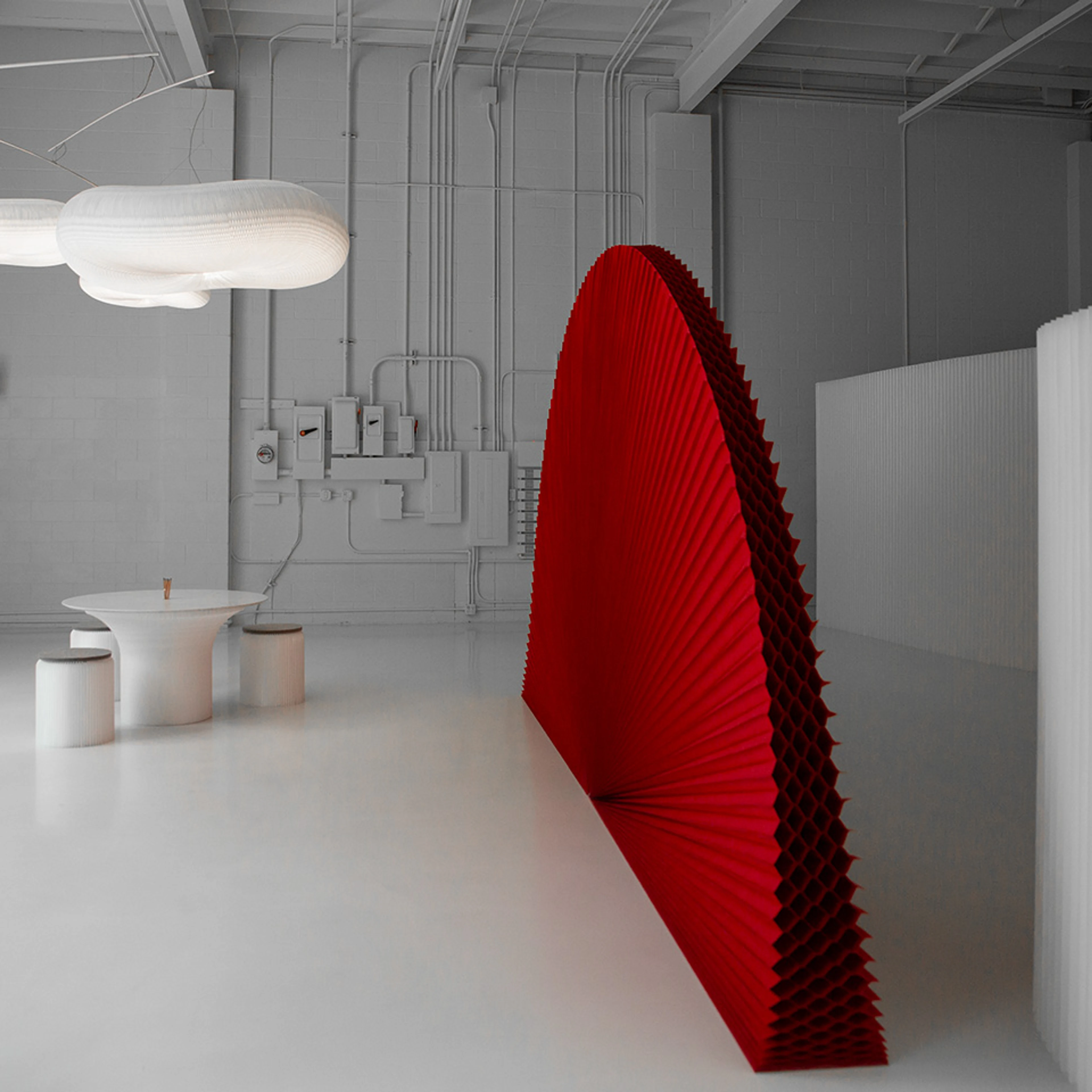 A red PMS 200 custom printed textile softwall against a natural white softwall.