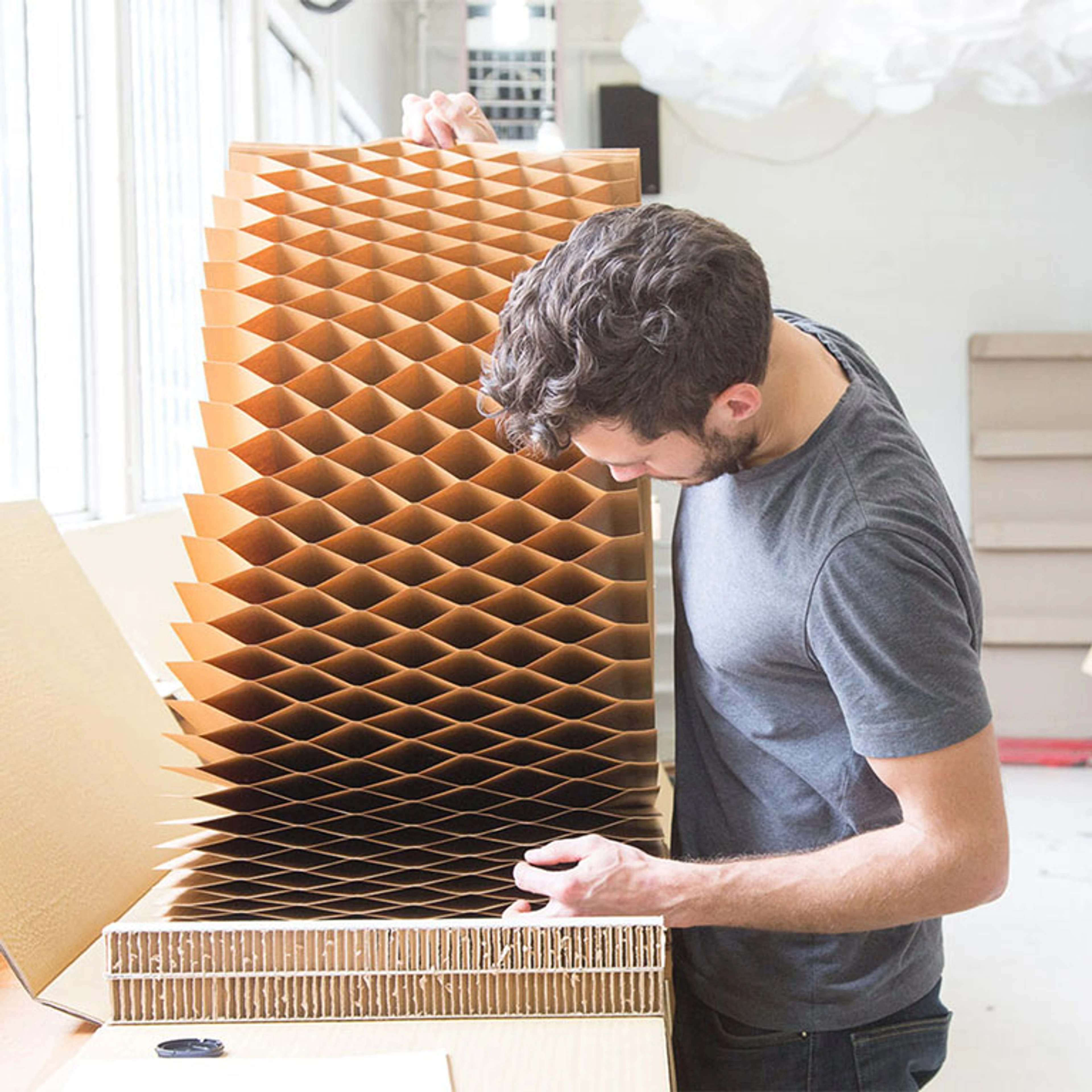 A molo studio assistant opens a softblock to check it for quality control.