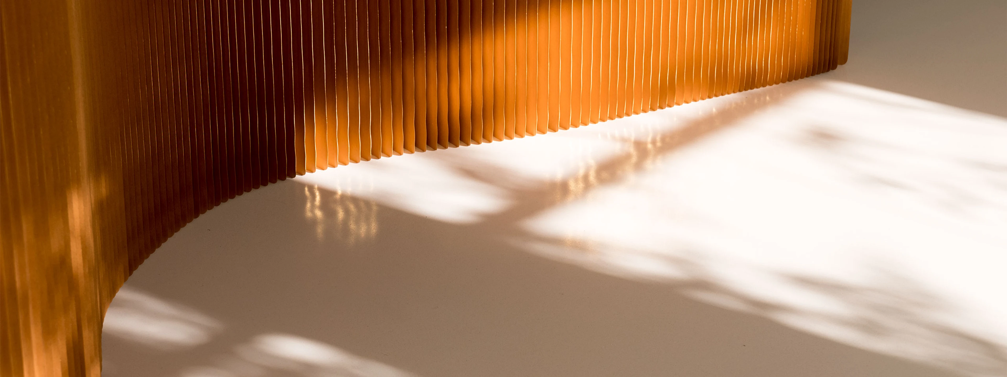 gilded paper pleats of a softwall - paper wall and seating