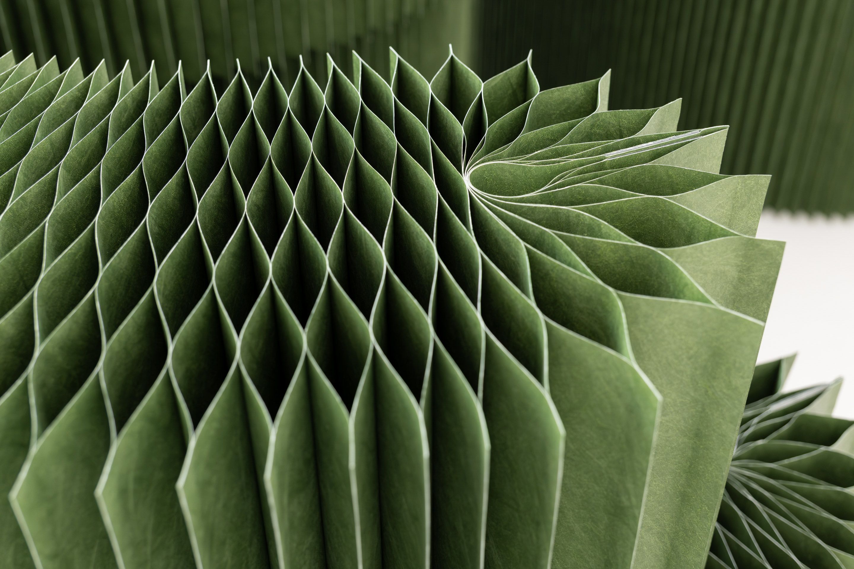 Closing the end panel creates a flowerlike shape, intentionally continuing the vertical pattern and enhancing stability.