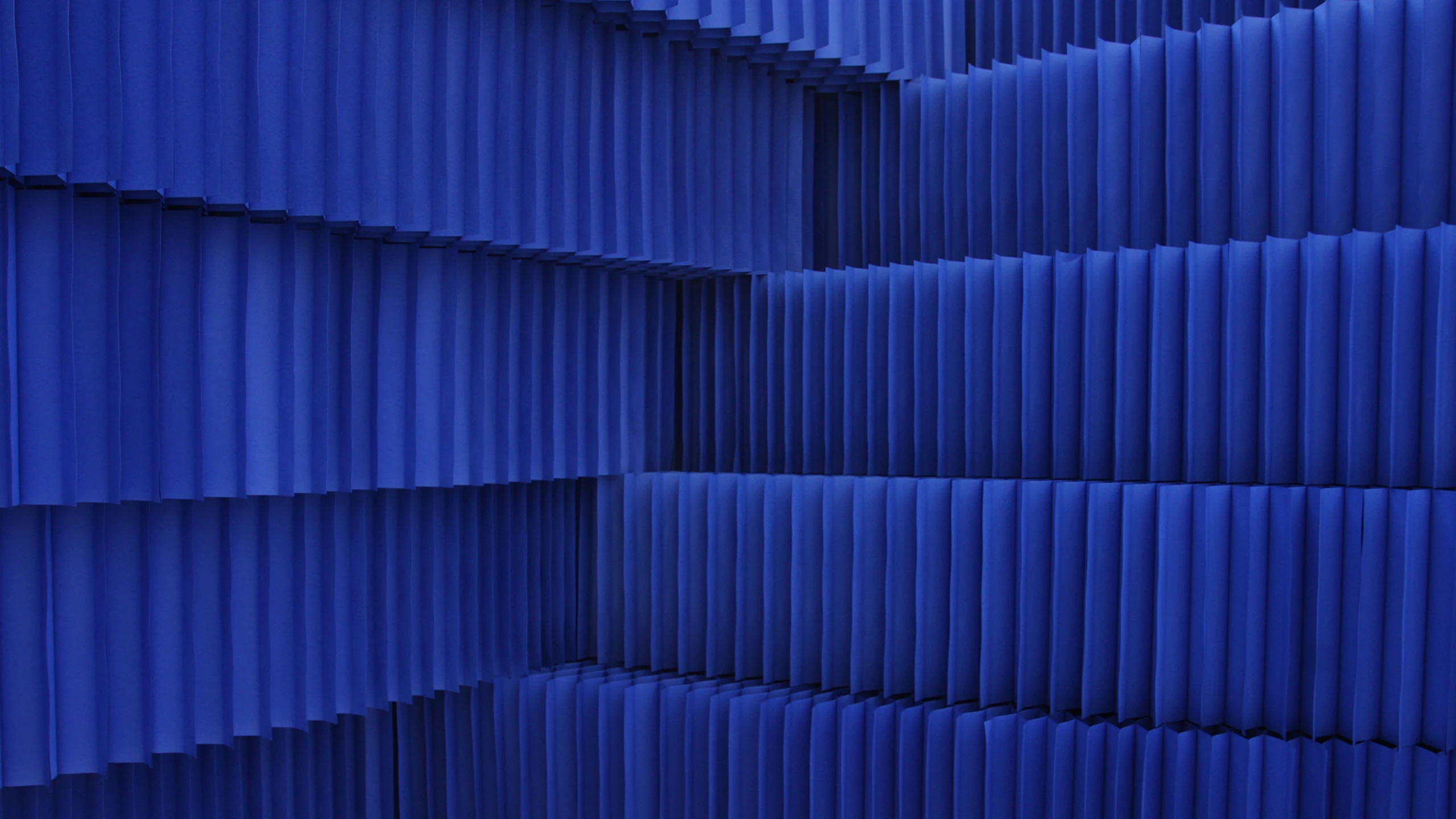 A blue wall made from flexible paper building blocks - acoustic design