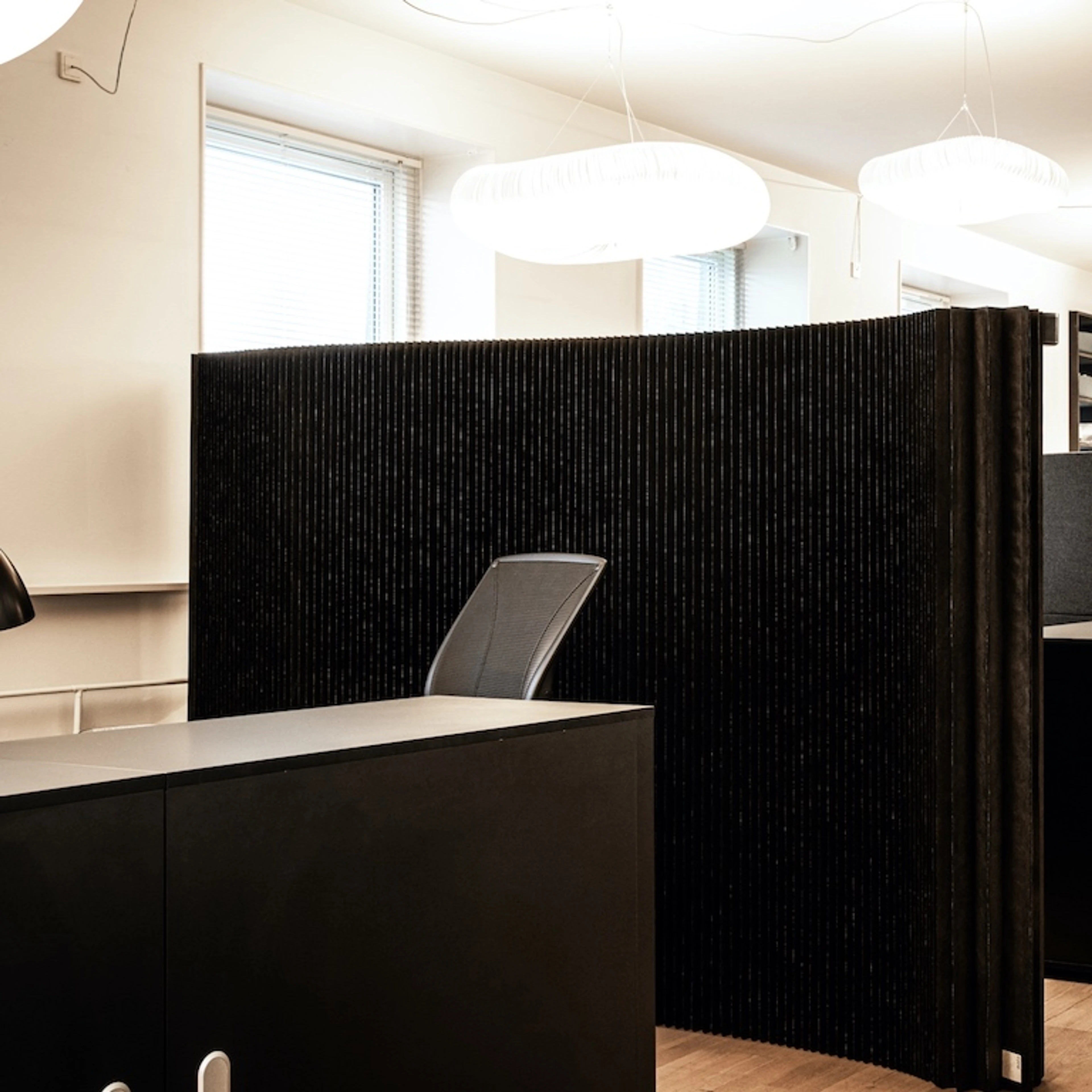 black textile folding mobile office divider