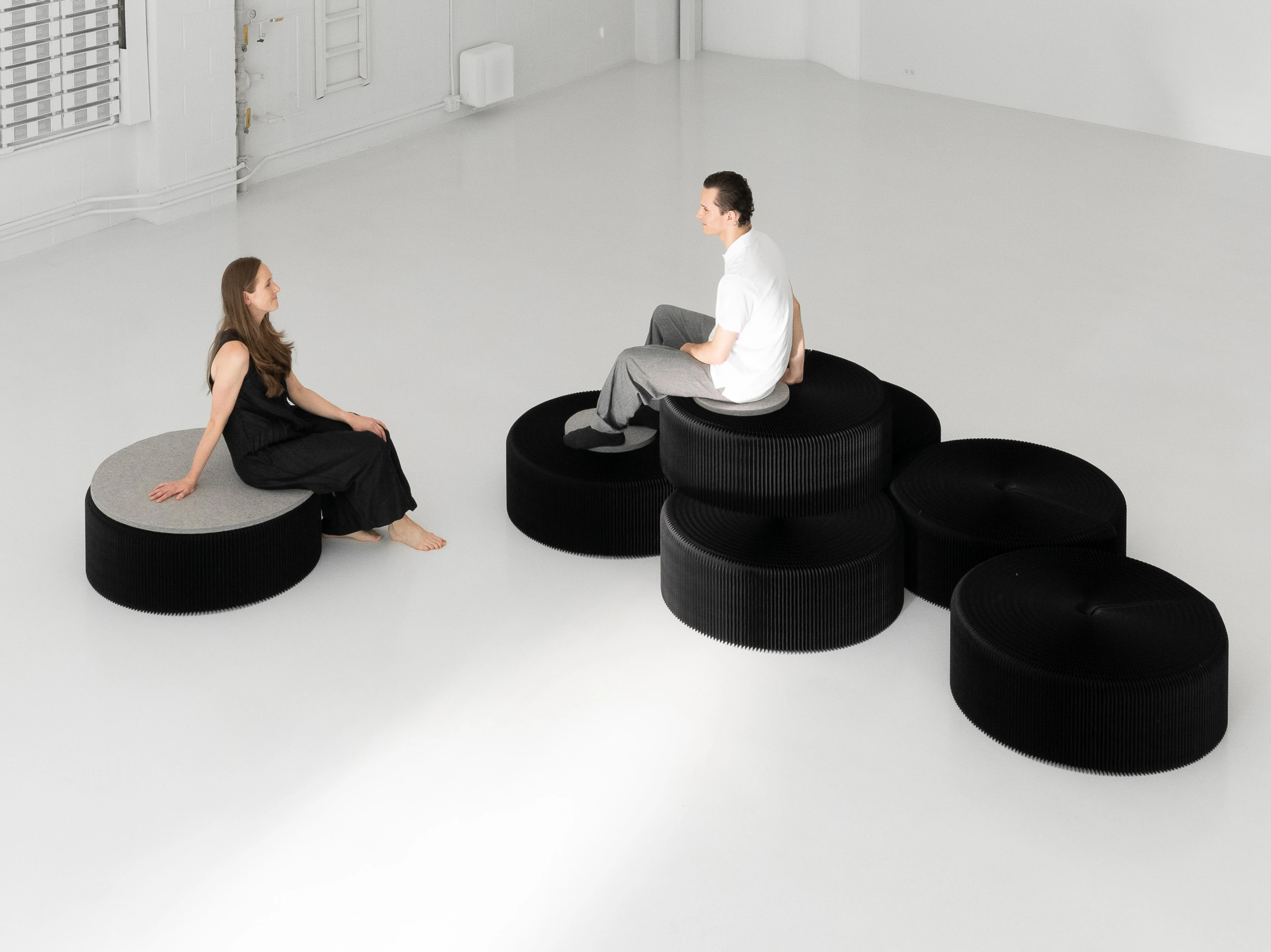 Build playful seating hills by stacking different sizes of softseating together.