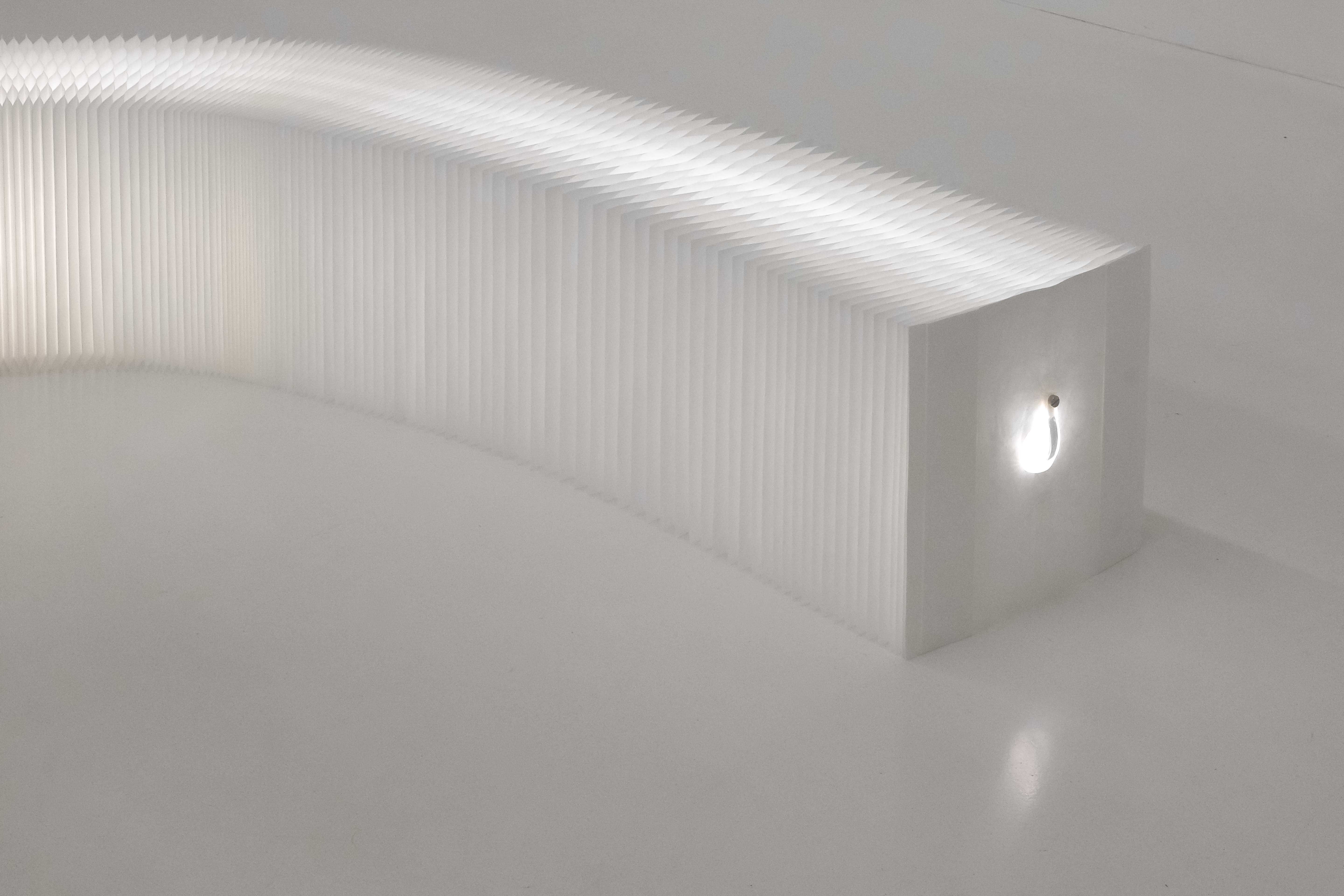 The LED ribbons fasten to the end panels on each side of softwall + softblock to stay in place.