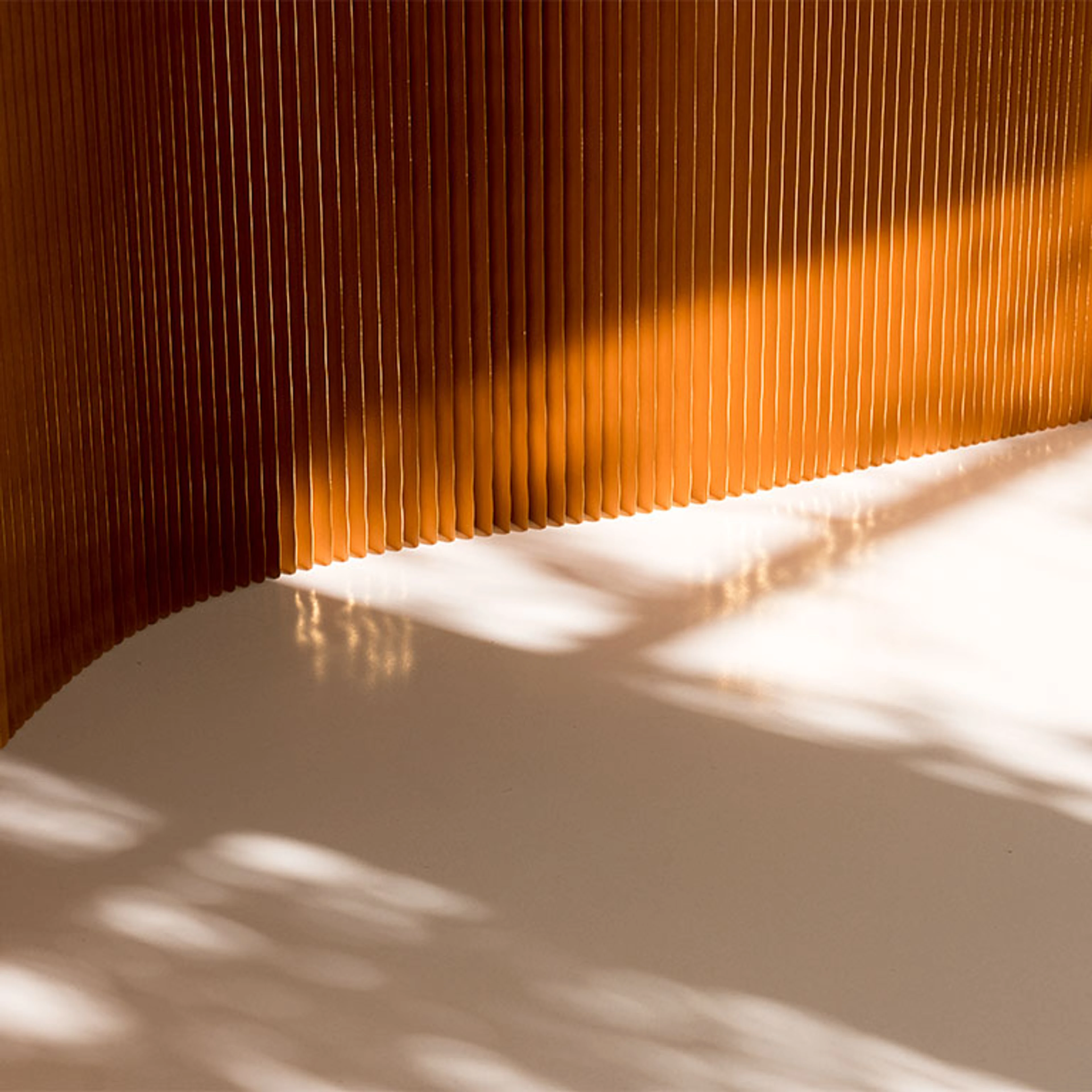 gilded paper pleats of a softwall - paper wall and seating
