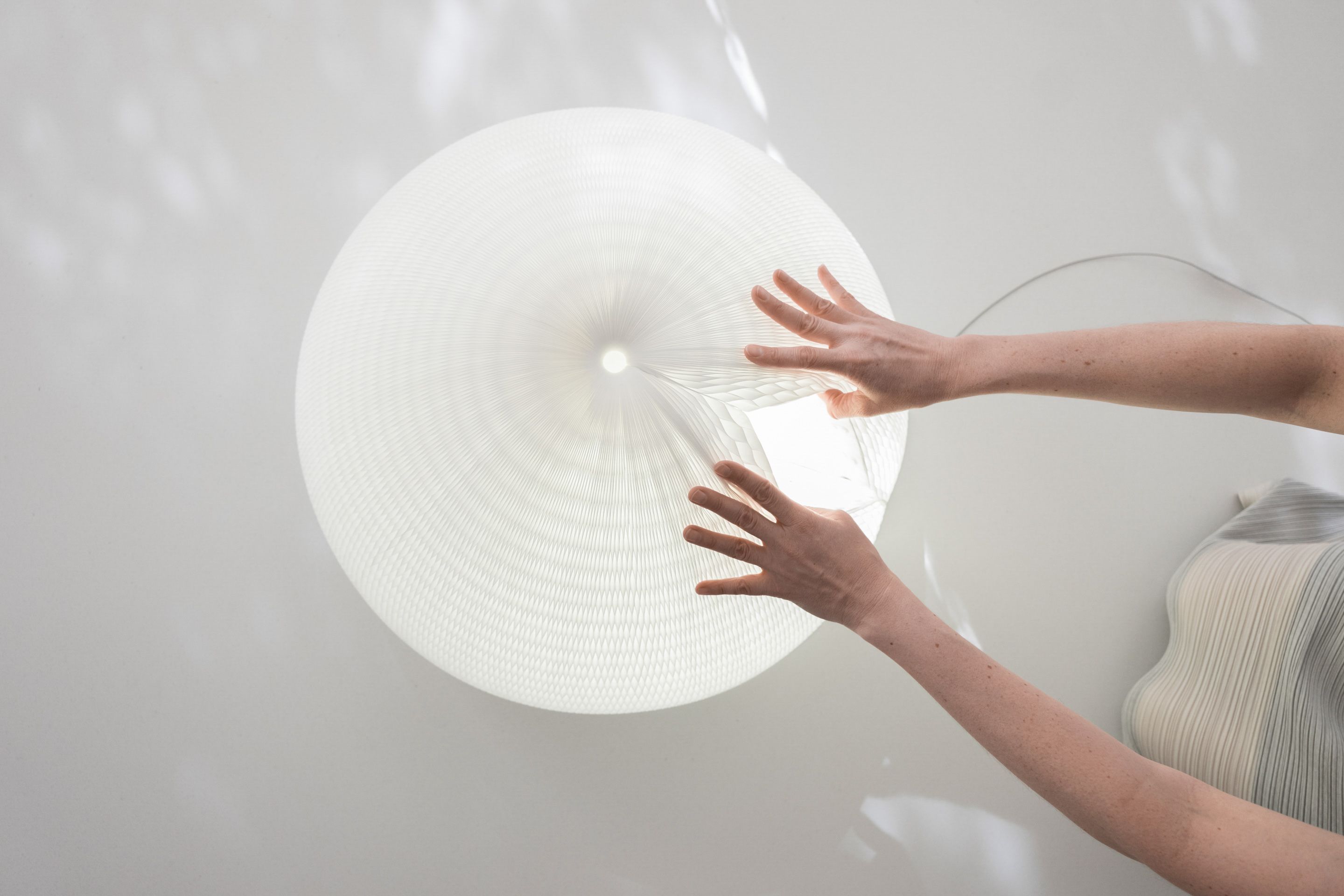 Rare earth magnets set into the textile create a hidden seam for the shade to fasten to itself.