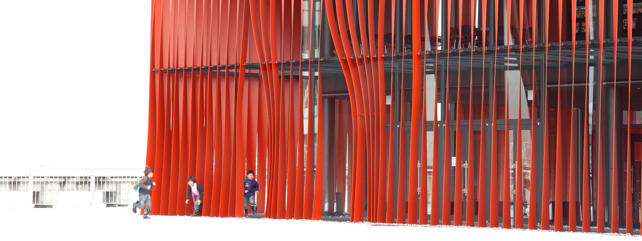 Children play in the snow outside Aomori Nebuta House.