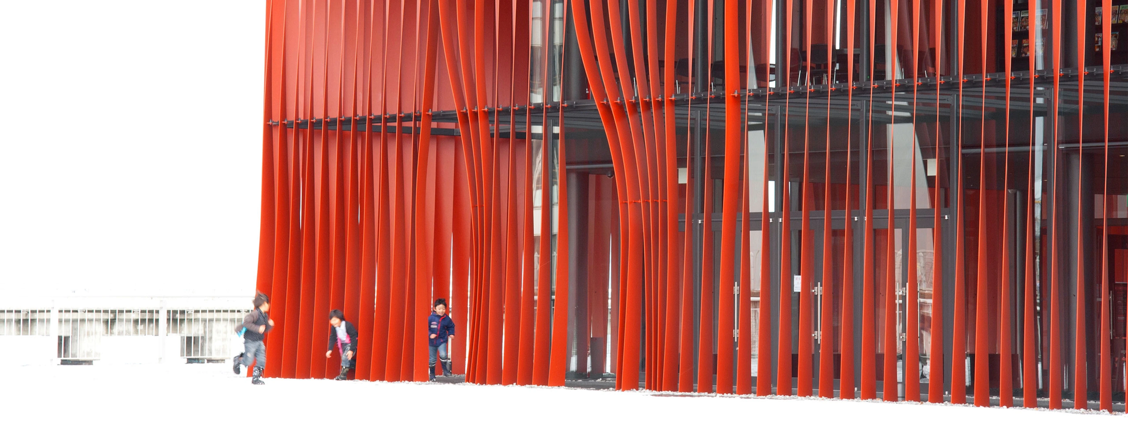 Children play in the snow outside Aomori Nebuta House.
