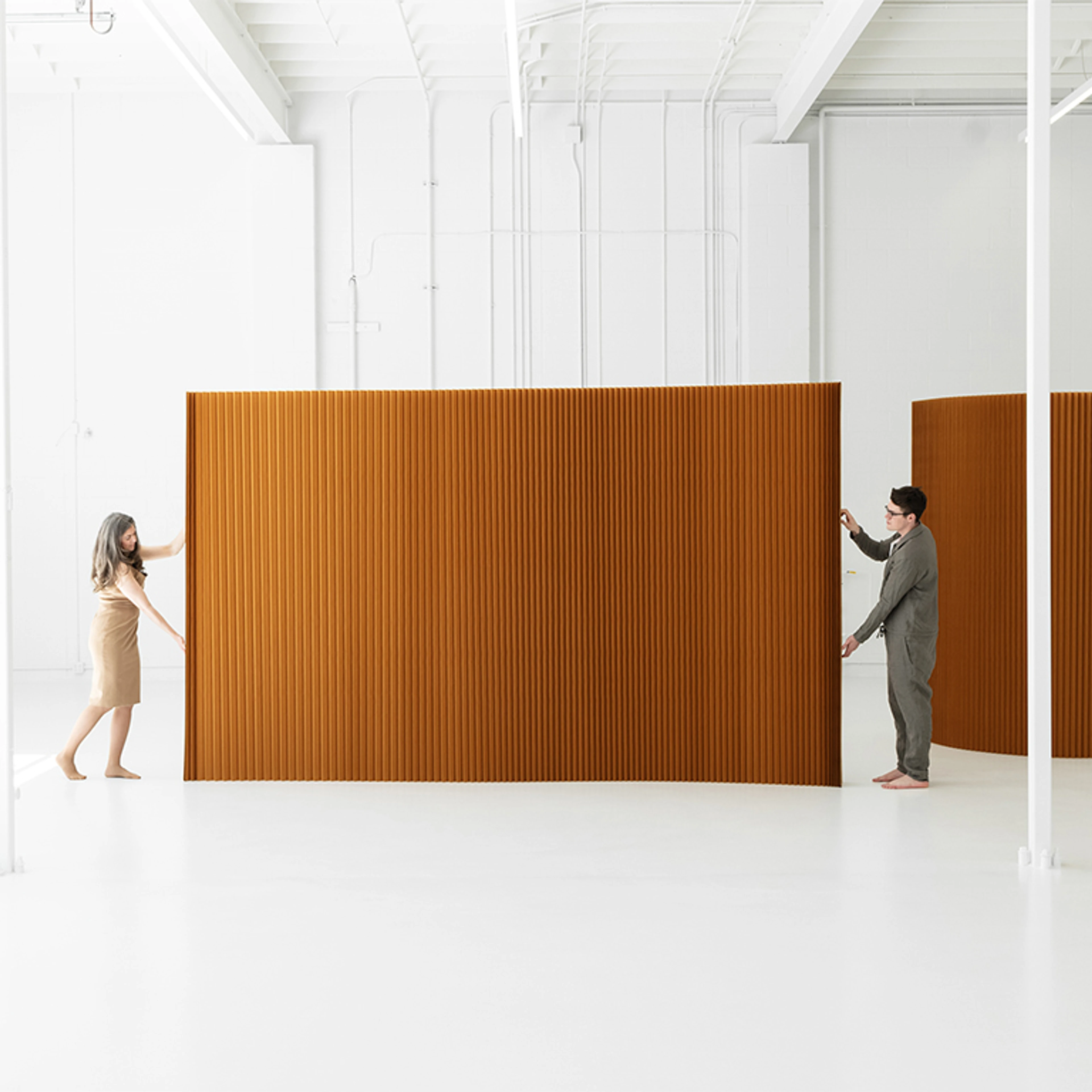 two people stretch wall partition