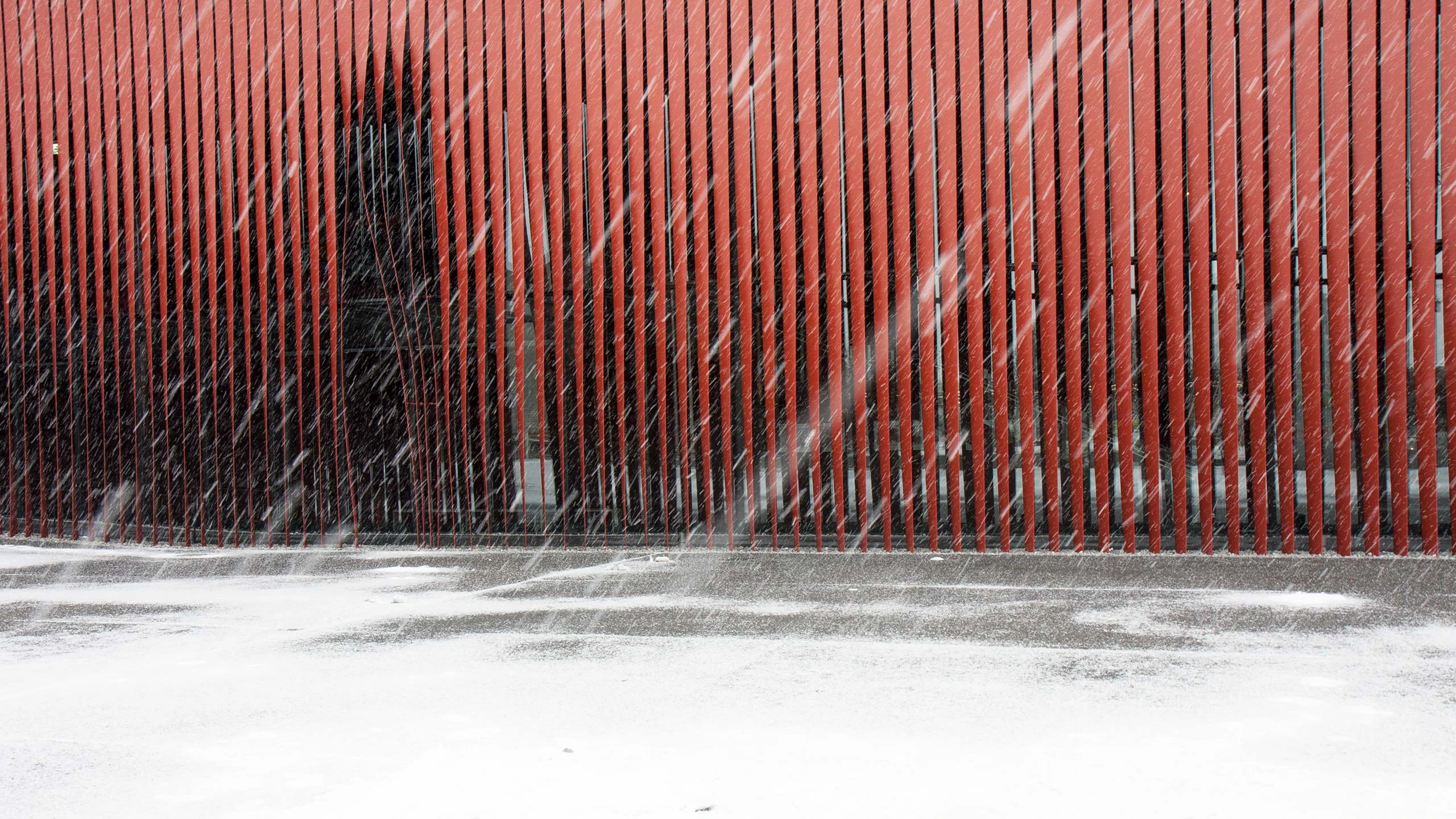A snowstorm emphasizes the architecture of Aomori Nebuta House.