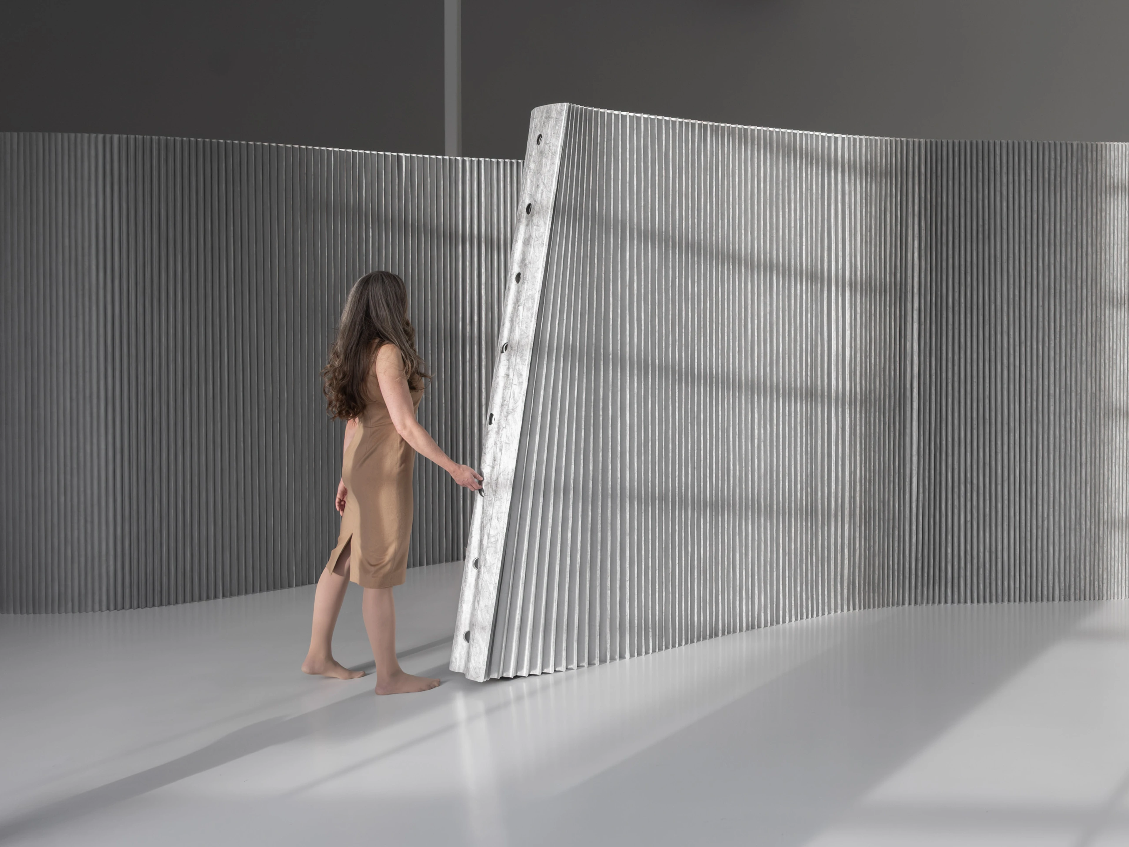 Tunnels serve as convenient handles for stretching or adjusting the wall's position, and integrate with a range of optional accessories.