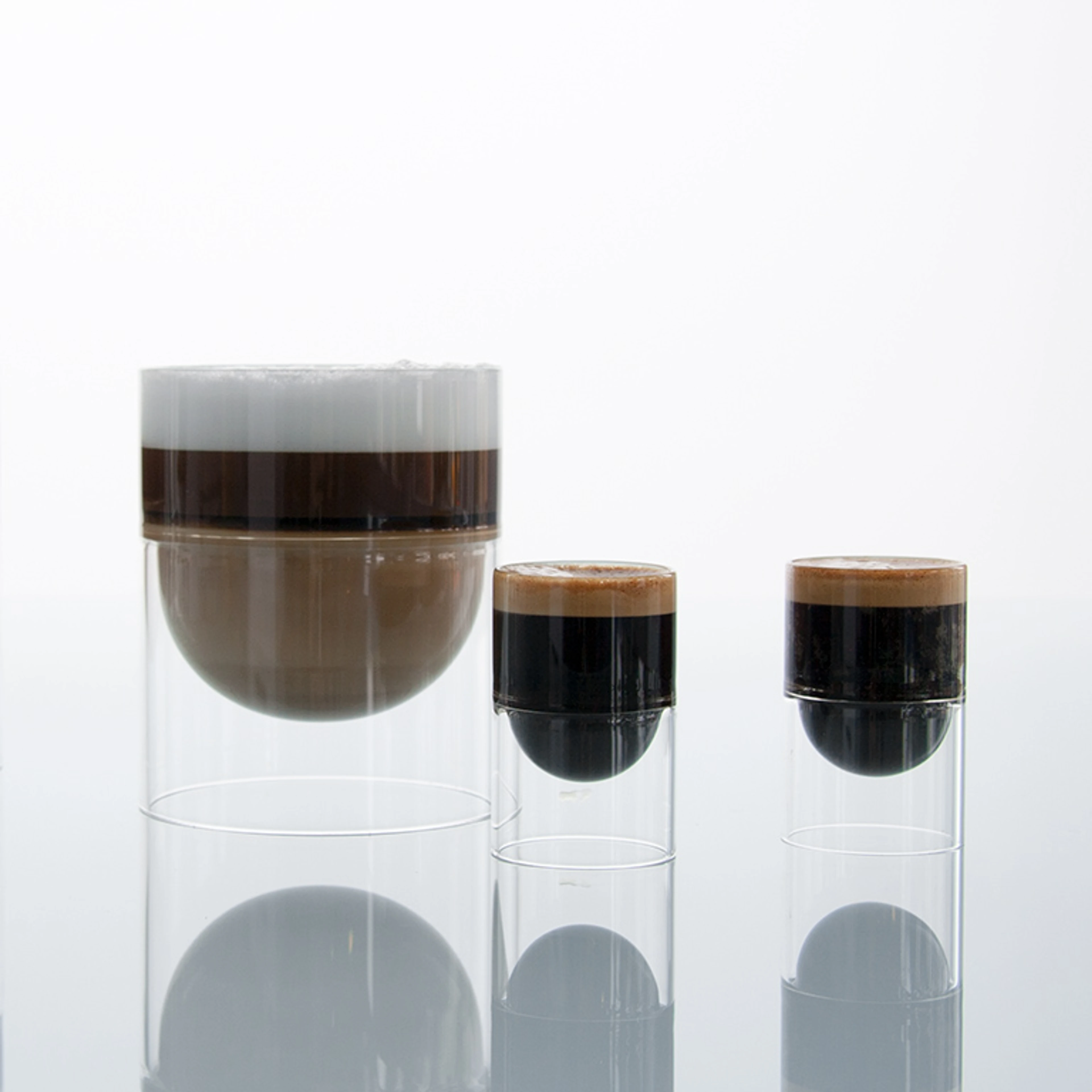 float glass coffee cup holding cappuccino and espresso