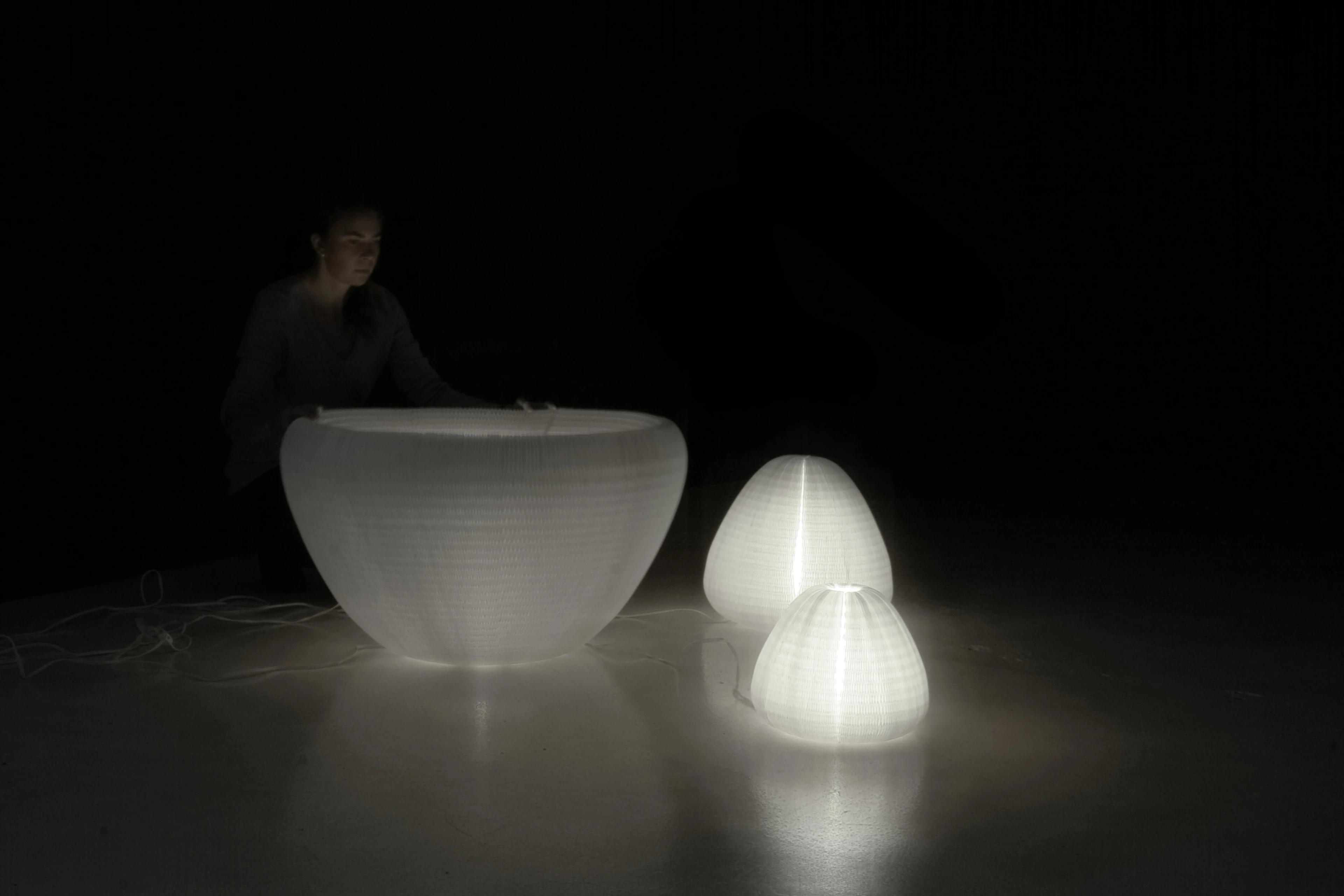 a woman plays with urchin softlight