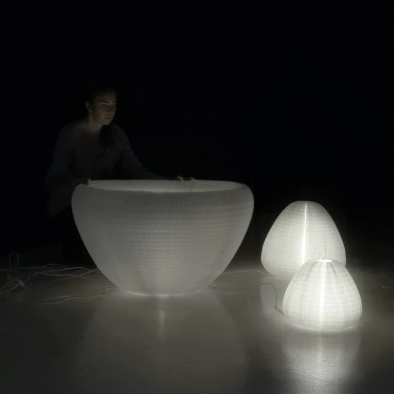 a woman plays with urchin softlight