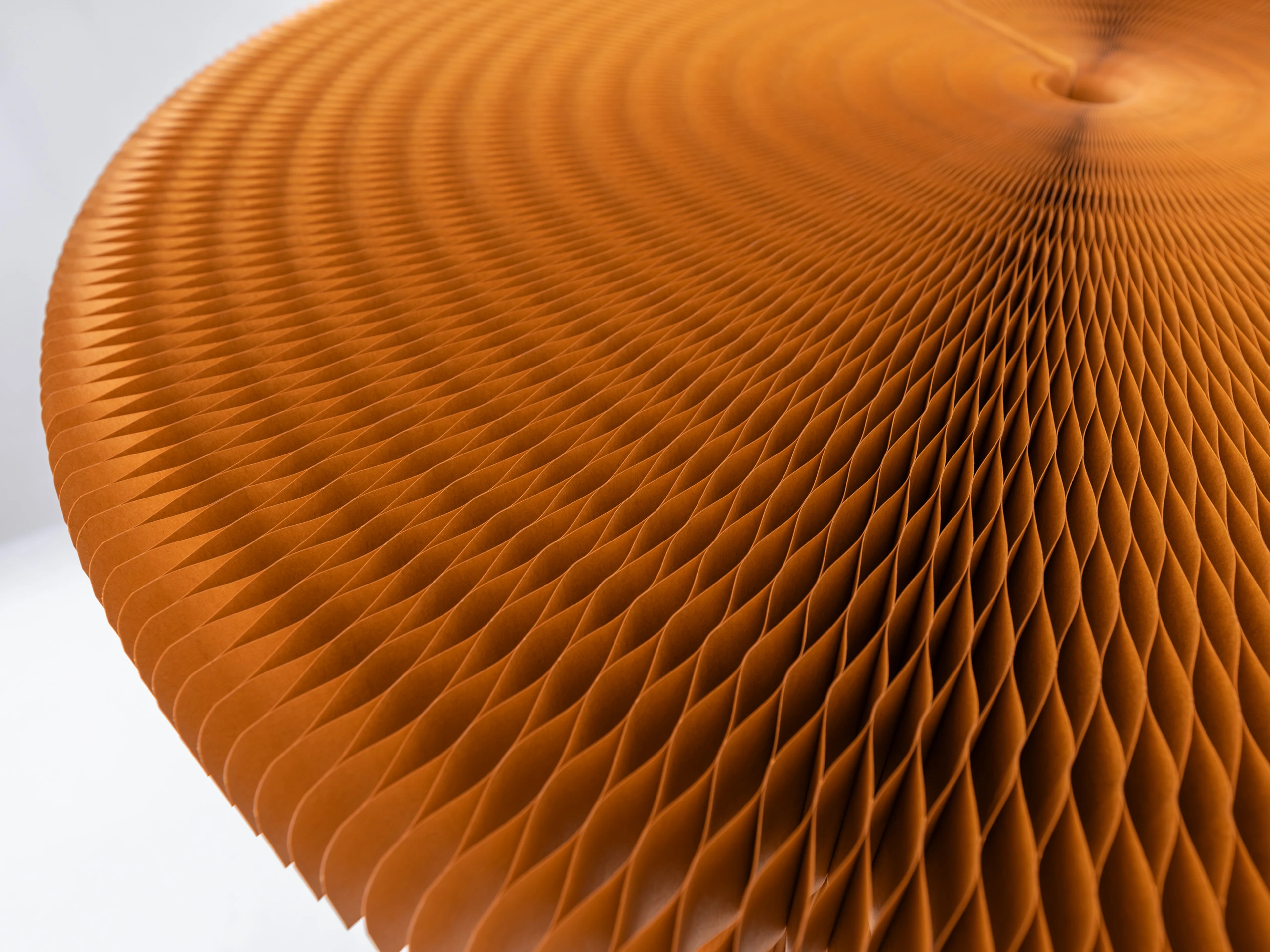 Honeycomb geometry offers the table base surprising strength, easily supporting PaperStone or marble tops.