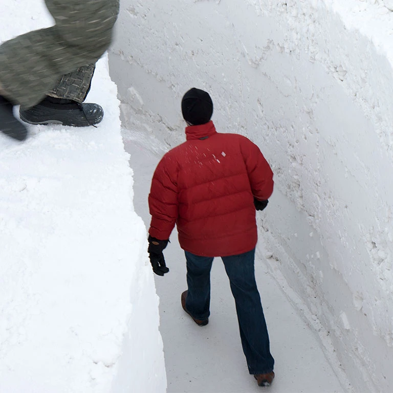 a child leaps over the snow passage at northern sky circle