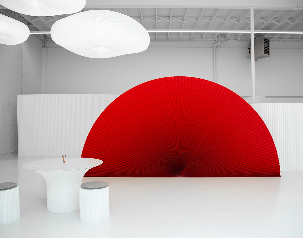 A red PMS 200 custom printed textile softwall against a natural white softwall.