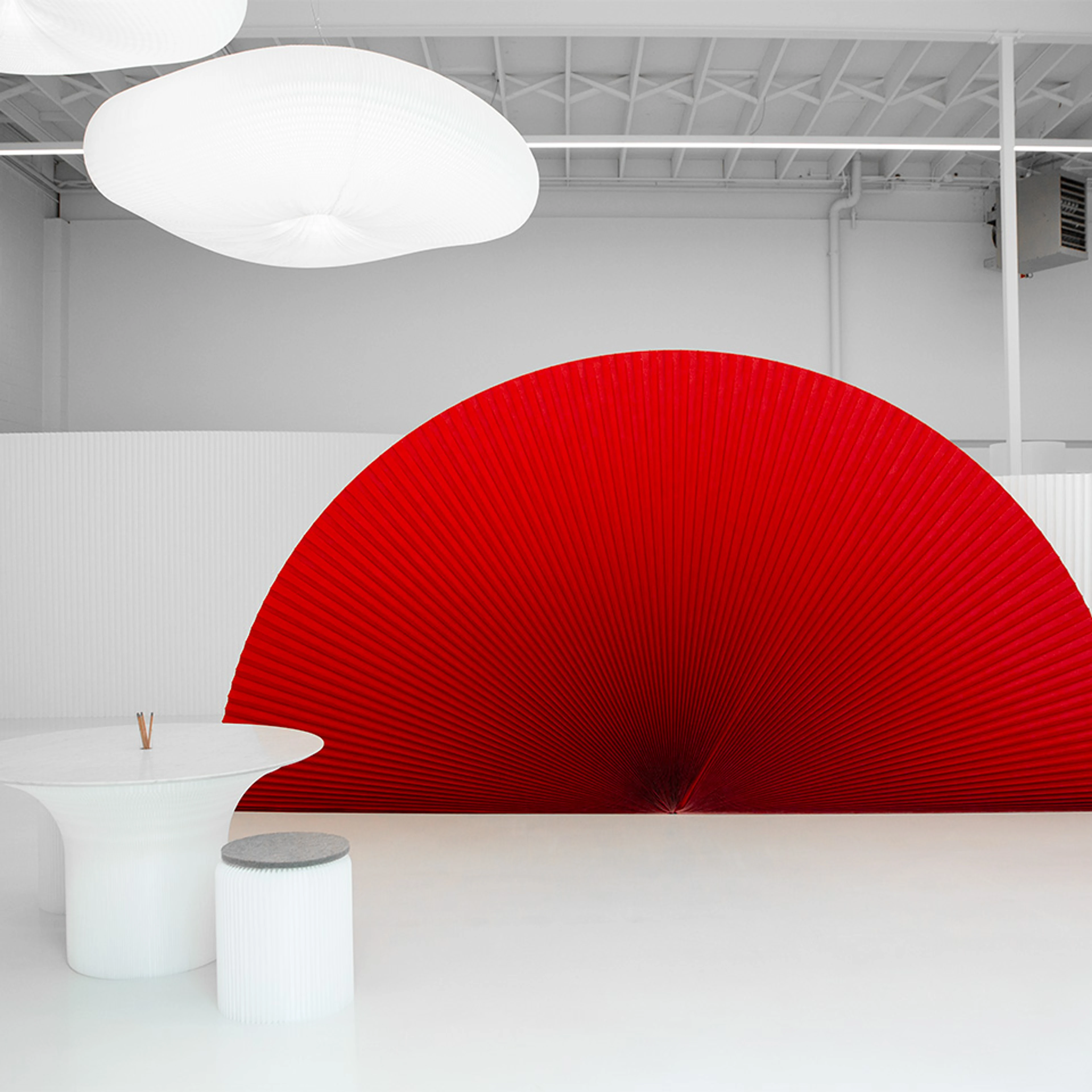 A red PMS 200 custom printed textile softwall against a natural white softwall.