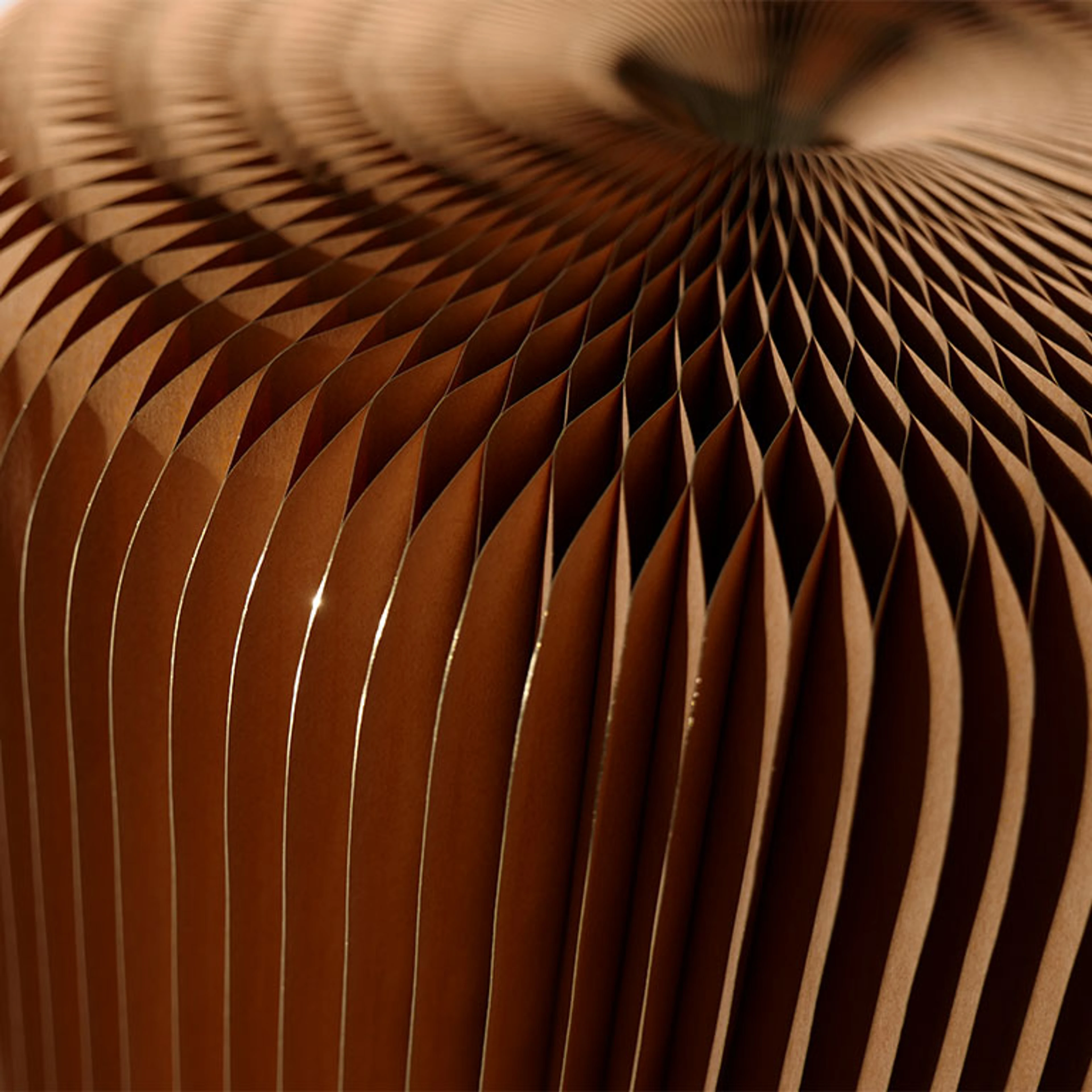 flexible seating - light reflects off the gilded paper pleats of a softseating fanning stool