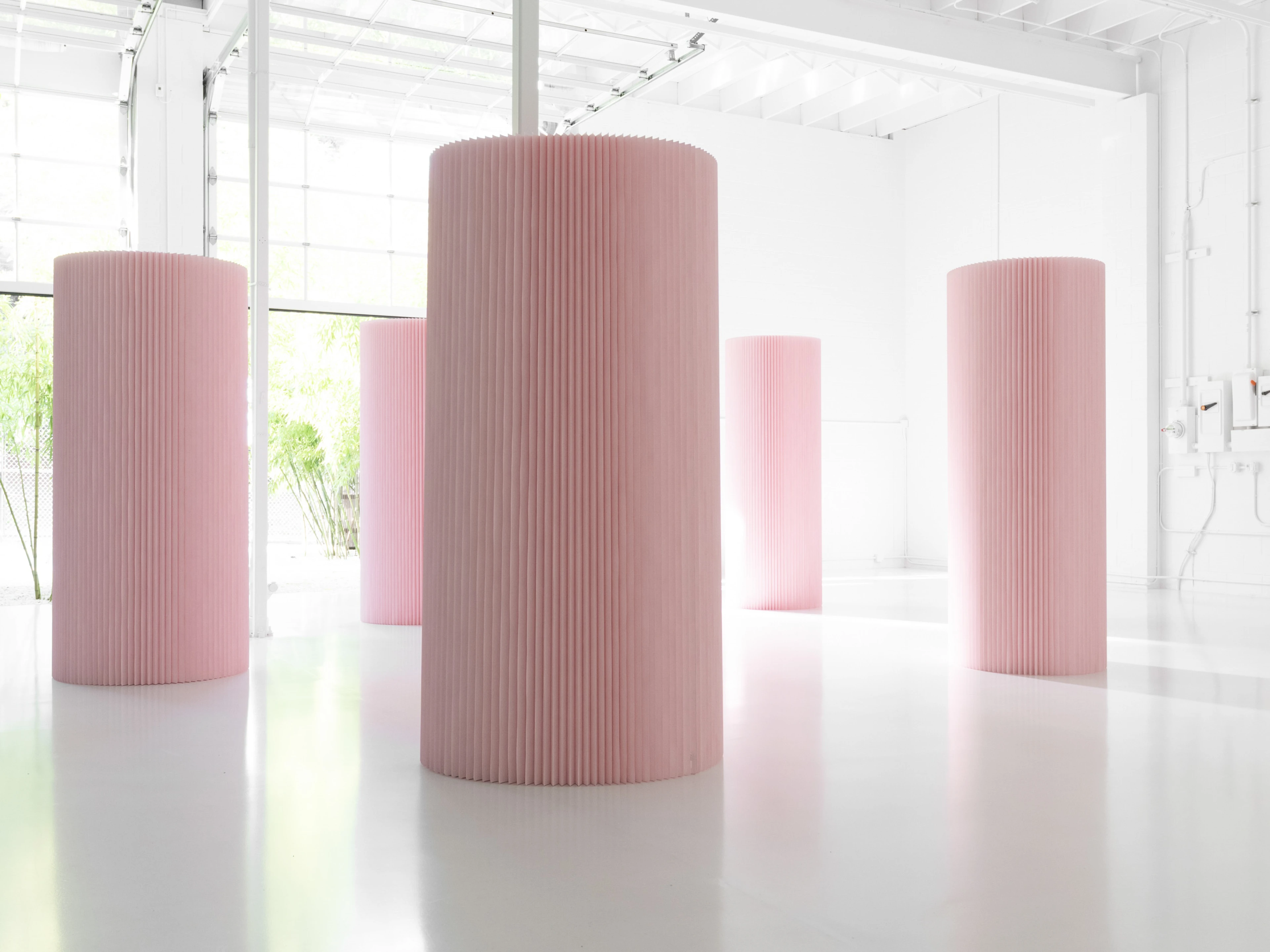 Connecting a softwall back on itself forms a column for storage or sculptural effect.