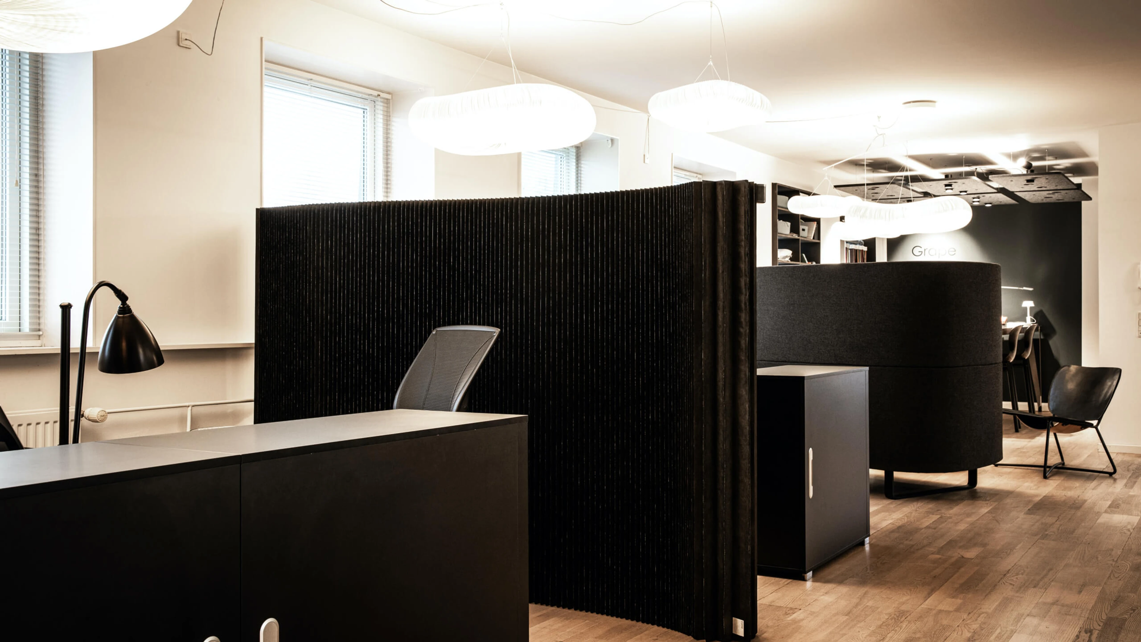 black textile folding office divider - how to maximize office space with free-standing movable walls