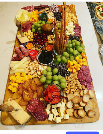 Large antipasto spread with meats, cheese, fruit and crackers