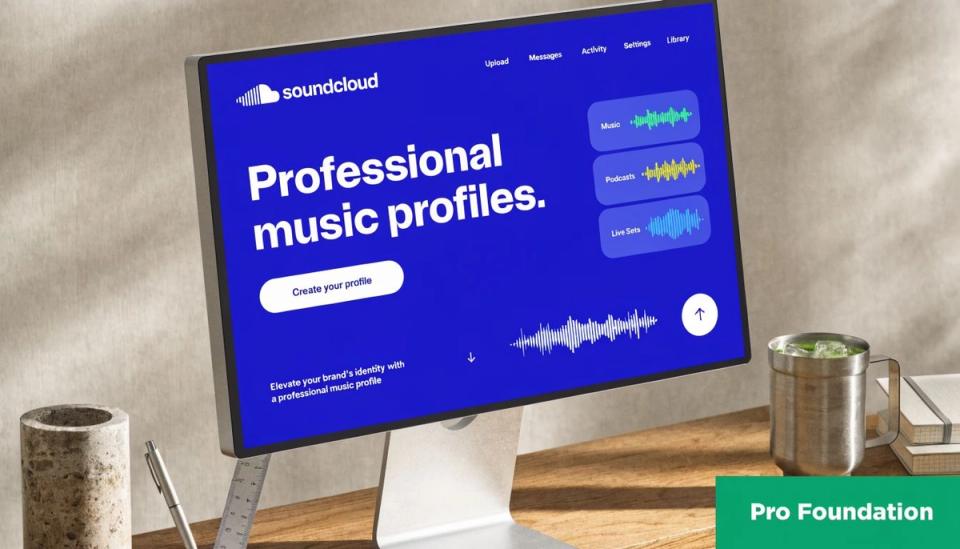 A professional SoundCloud music profile landing page displayed on a computer screen on an office desk.