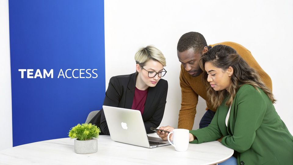 Three diverse colleagues collaborate on a laptop and smartphone in an office with "TEAM ACCESS" signage.