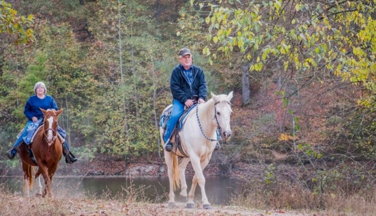 horseback riders on the trail