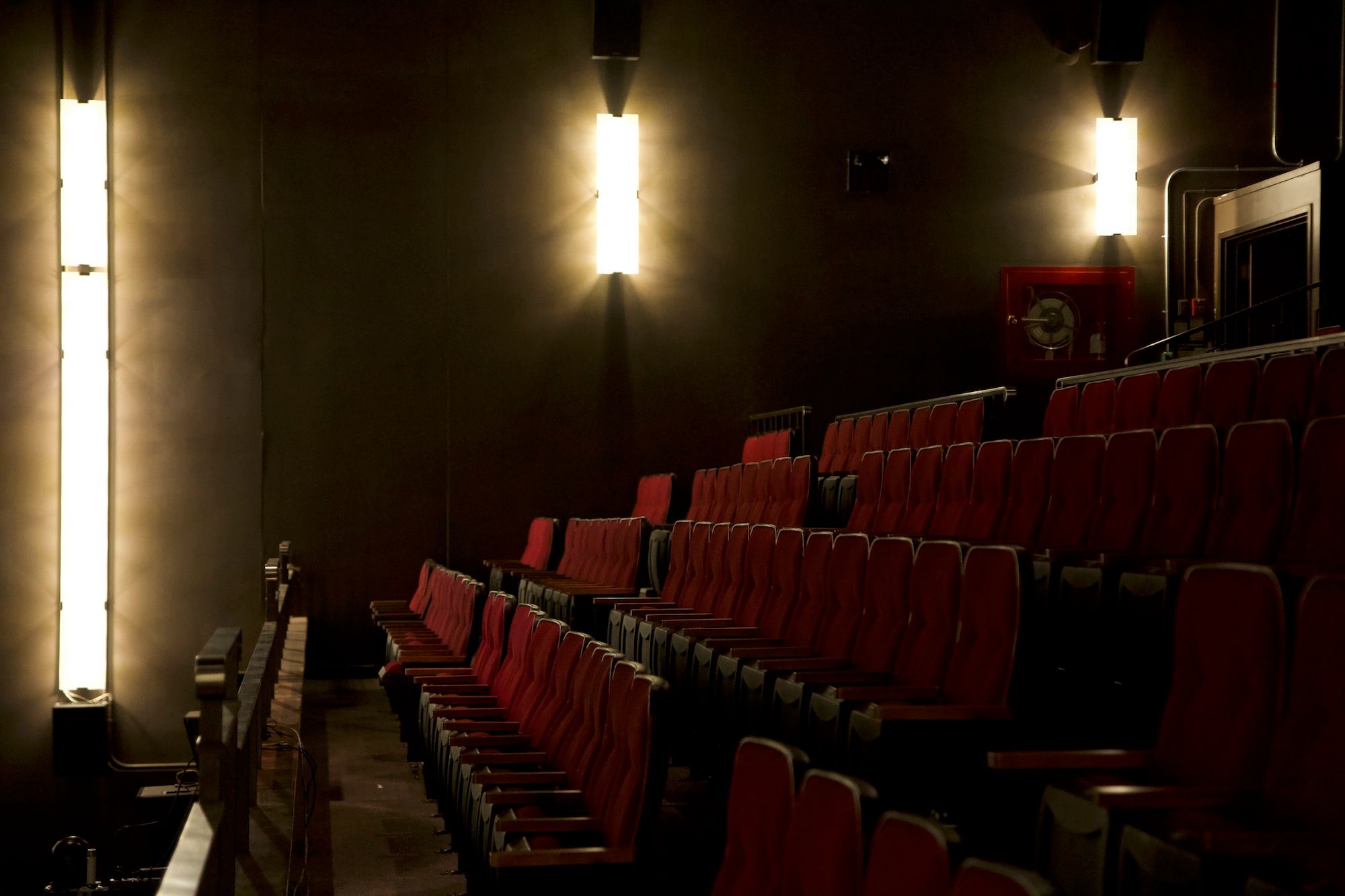 Red seating and the art-deco wall lights