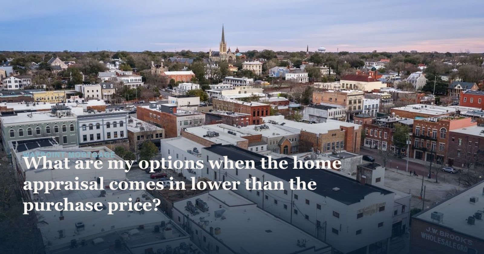 Aerial view of historic downtown Wilmington, NC showcasing urban architecture and church spires.
