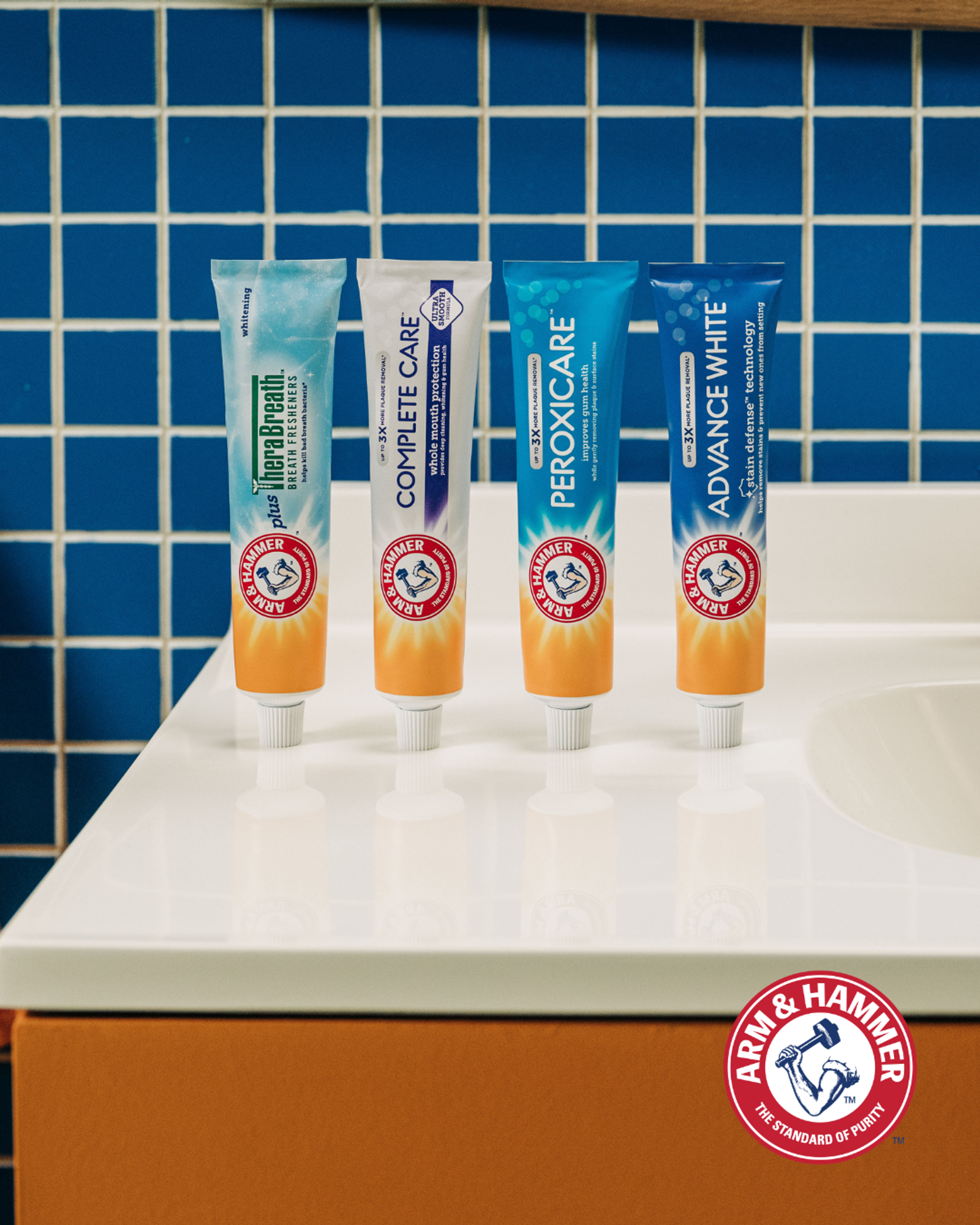 Arm & Hammer Toothpaste products displayed in front of tiles