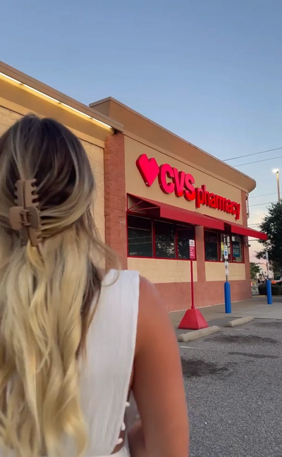 Video thumbnail of a woman walking into CVS