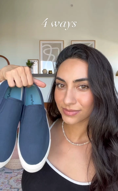Video thumbnail of a woman holding shoes