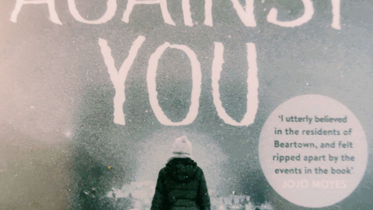 Cover detail of Us Against You by Fredrik Backman showing a woman walking in the snow