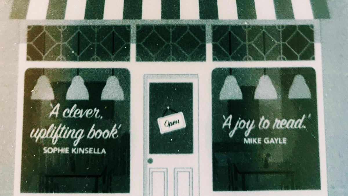 Cover detail of The Authenticity Project by Clare Pooley showing a cheerful shop window