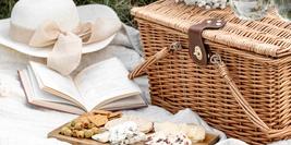 Photo by Evangelina Silina on Unsplash showing a picnic on a white blanket