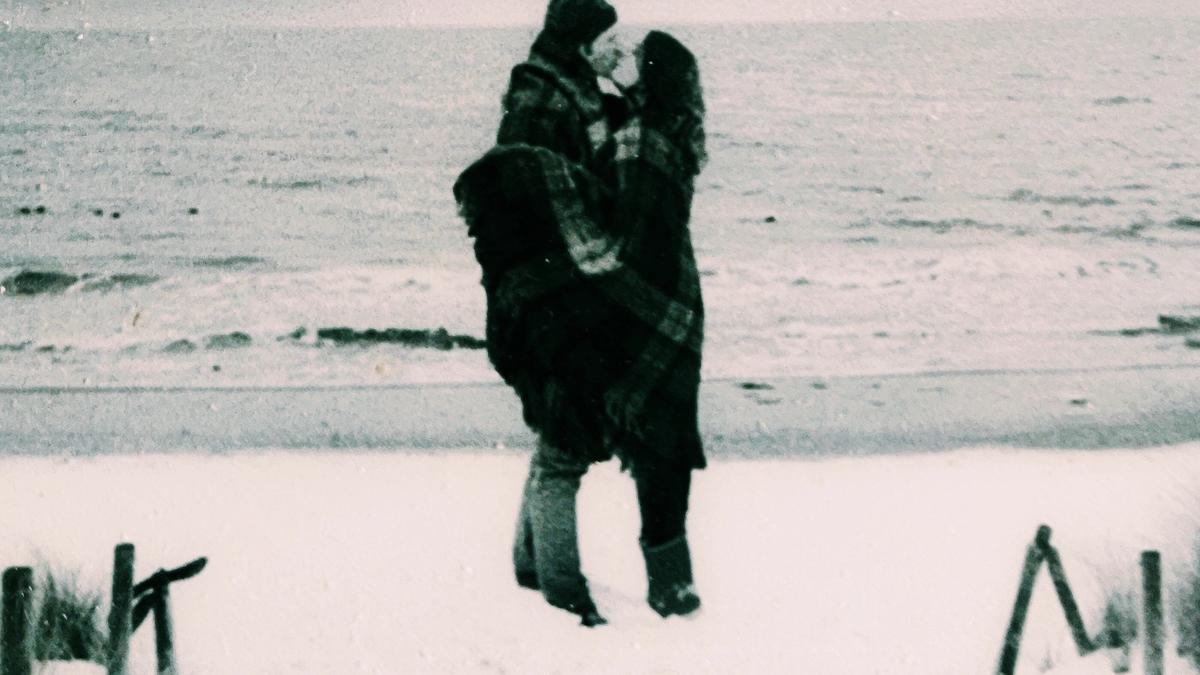 Cover detail of Winter Storms - Elin Hildebrand showing a black and white image of a couple kissing. 