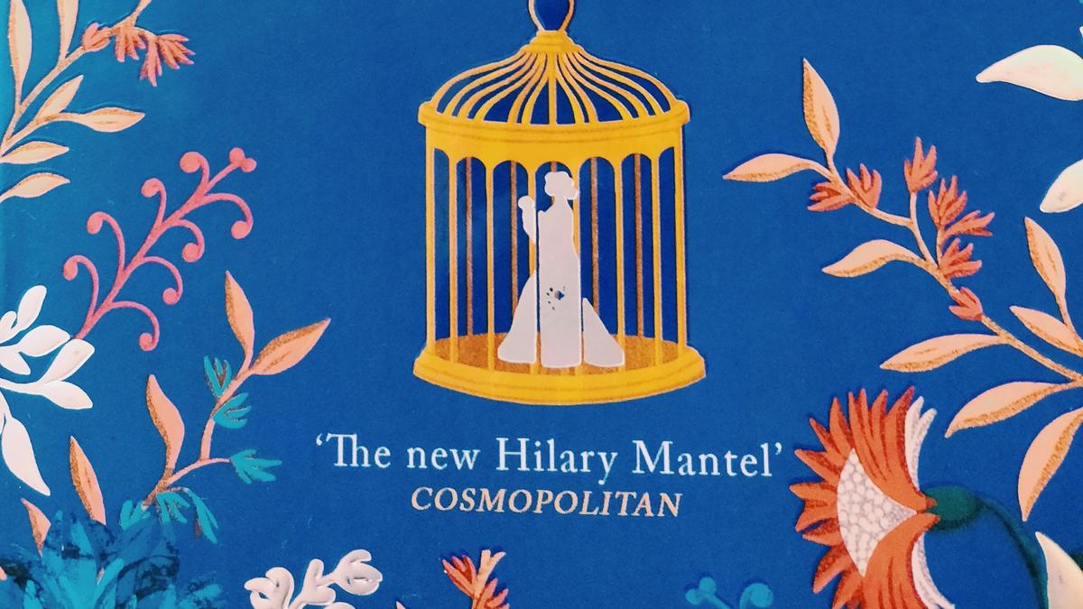 Cover detail of The Foundling by Stacey Halls showing a painted birdcage on a blue background