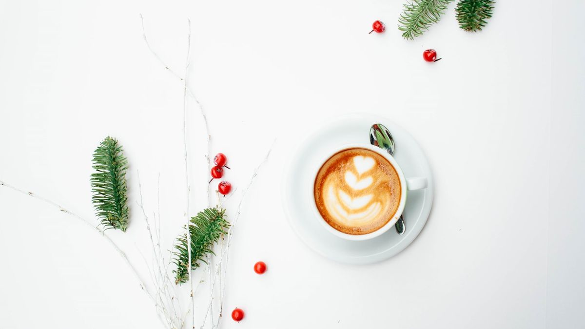 Photo by Toa Heftiba on Unsplash showing a coffee cup on a white background