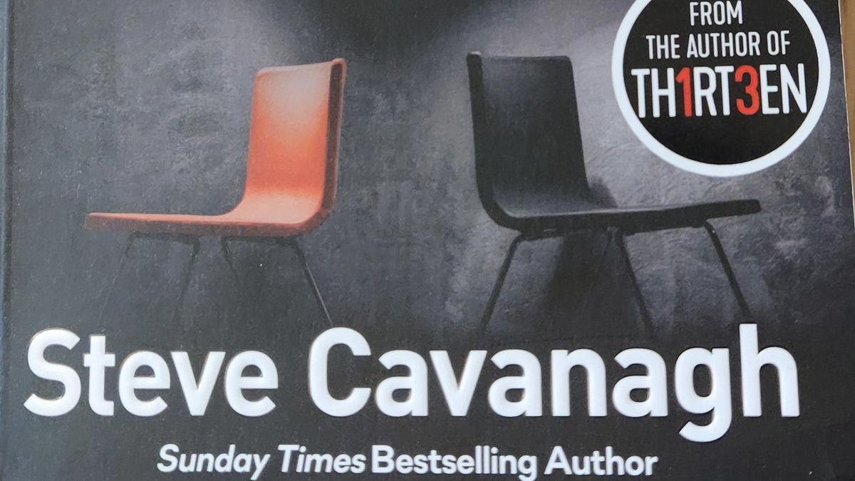 Cover detail of Fifty Fifty by Steve Cavanagh, showing an orange and black chair back to back