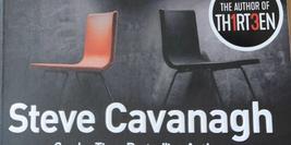 Cover detail of Fifty Fifty by Steve Cavanagh, showing an orange and black chair back to back
