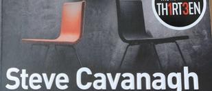 Cover detail of Fifty Fifty by Steve Cavanagh, showing an orange and black chair back to back
