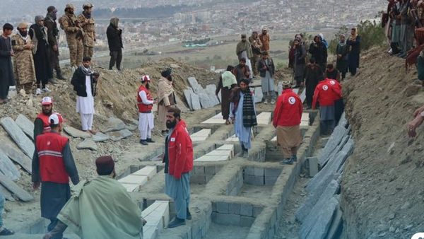 Families Search Coffins at Taliban Mass Funerals for Kabul Drug Rehab Center Airstrike Victims