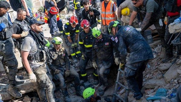 Man and teenage son rescued from Venezuela earthquake rubble as death toll rises