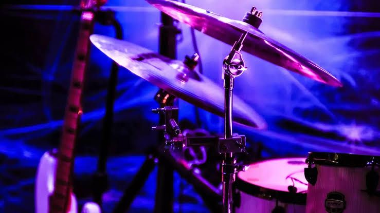 A drum kit and a guitar