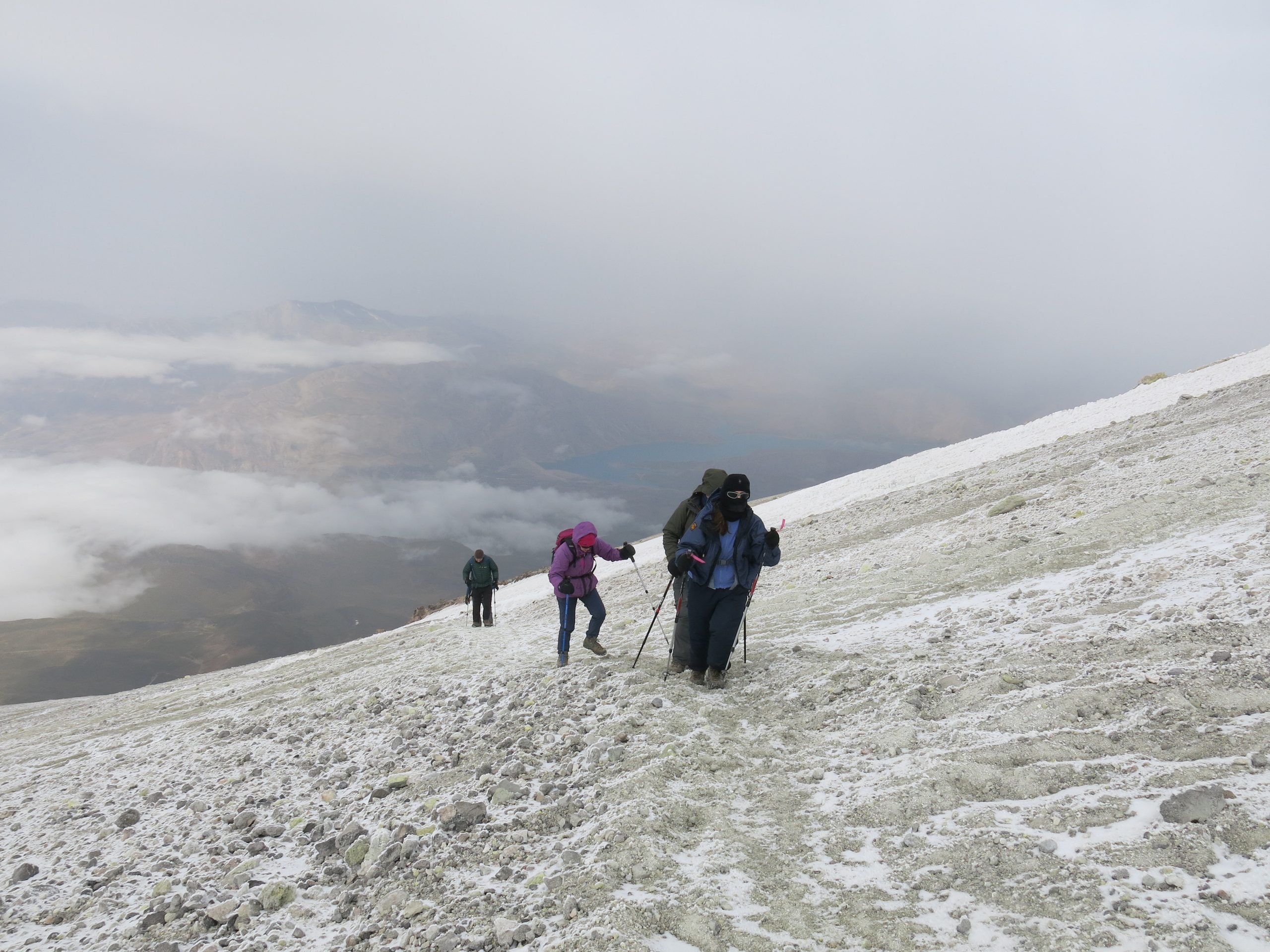 The team, 200m from the summit. The yellow tint in the snow is from the sulphur.