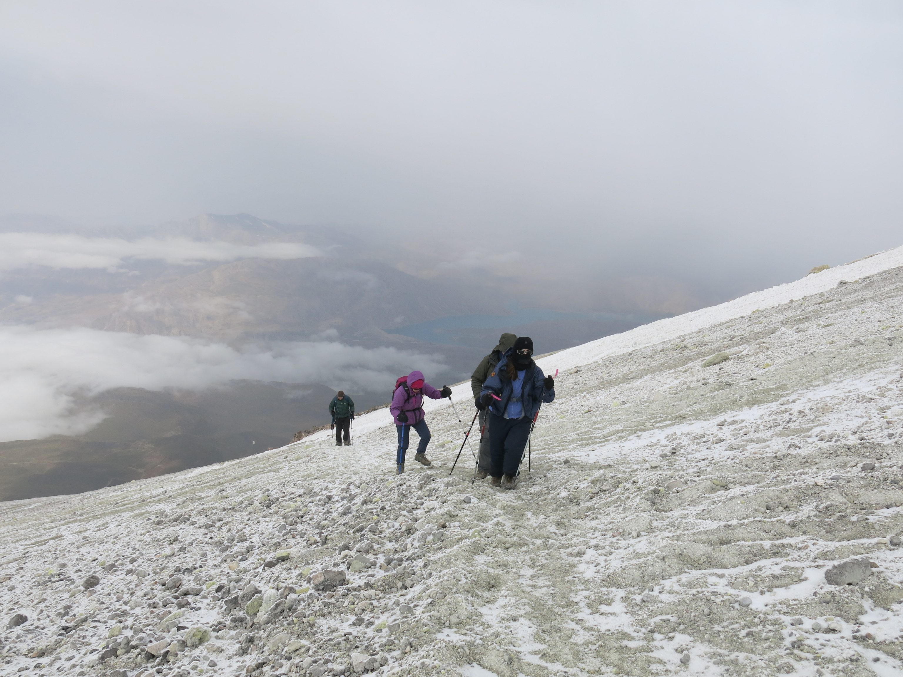 The team, 200m from the summit. The yellow tint in the snow is from the sulphur.