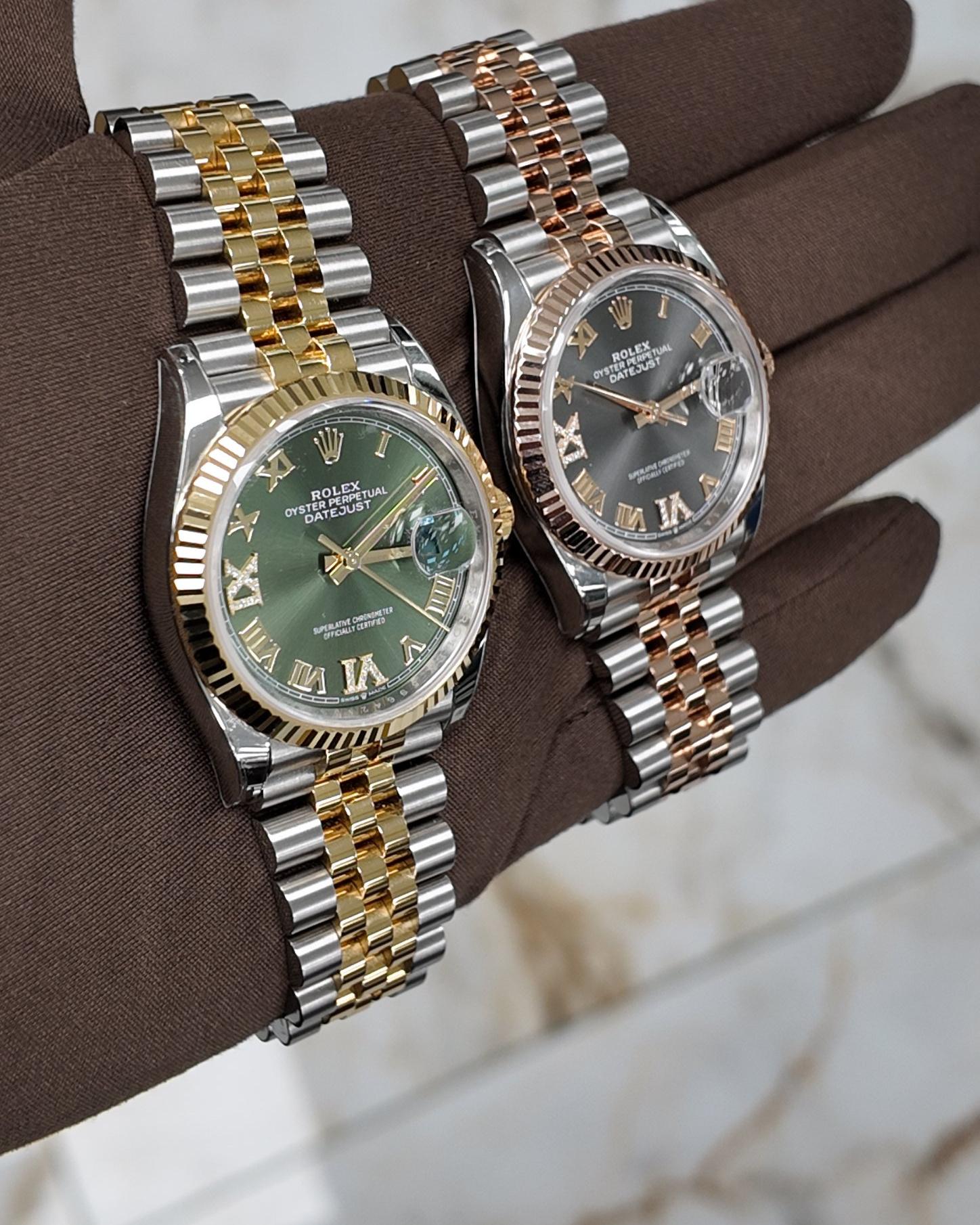 Two two-tone Rolex Datejusts on Jubilee bracelets, on a gloved hand
