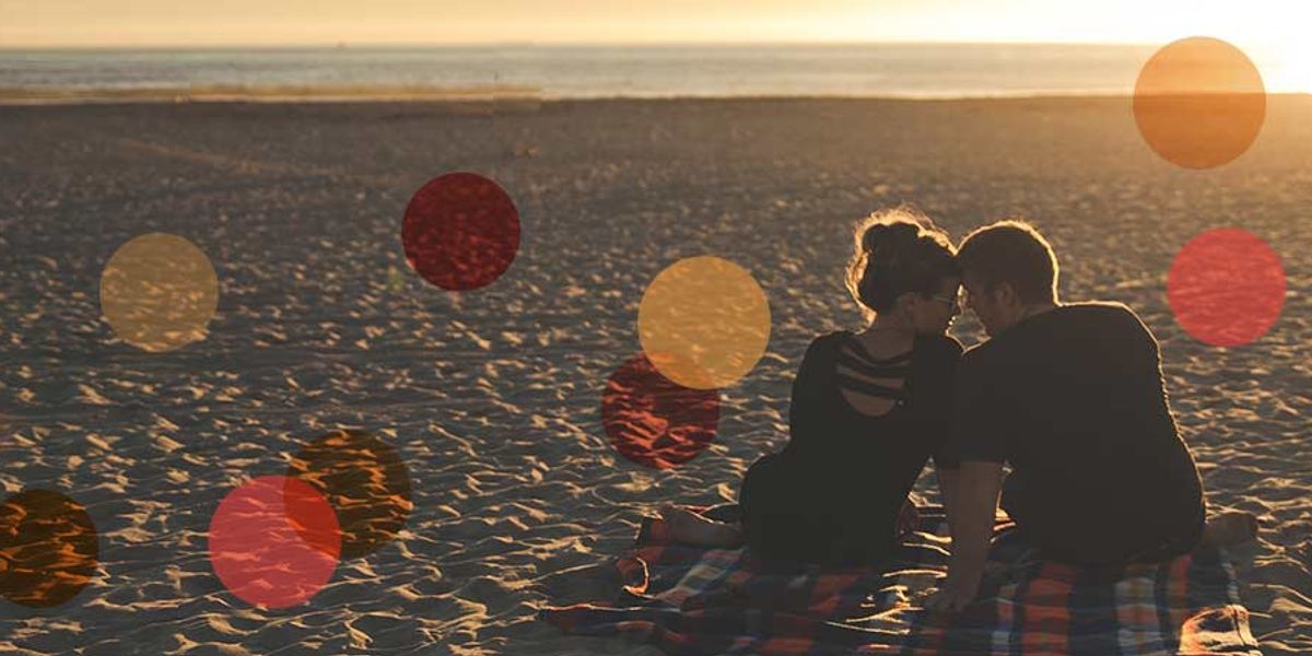 couple having a picnic on the beach